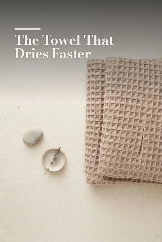 Neutral waffle towel arranged on a light surface
